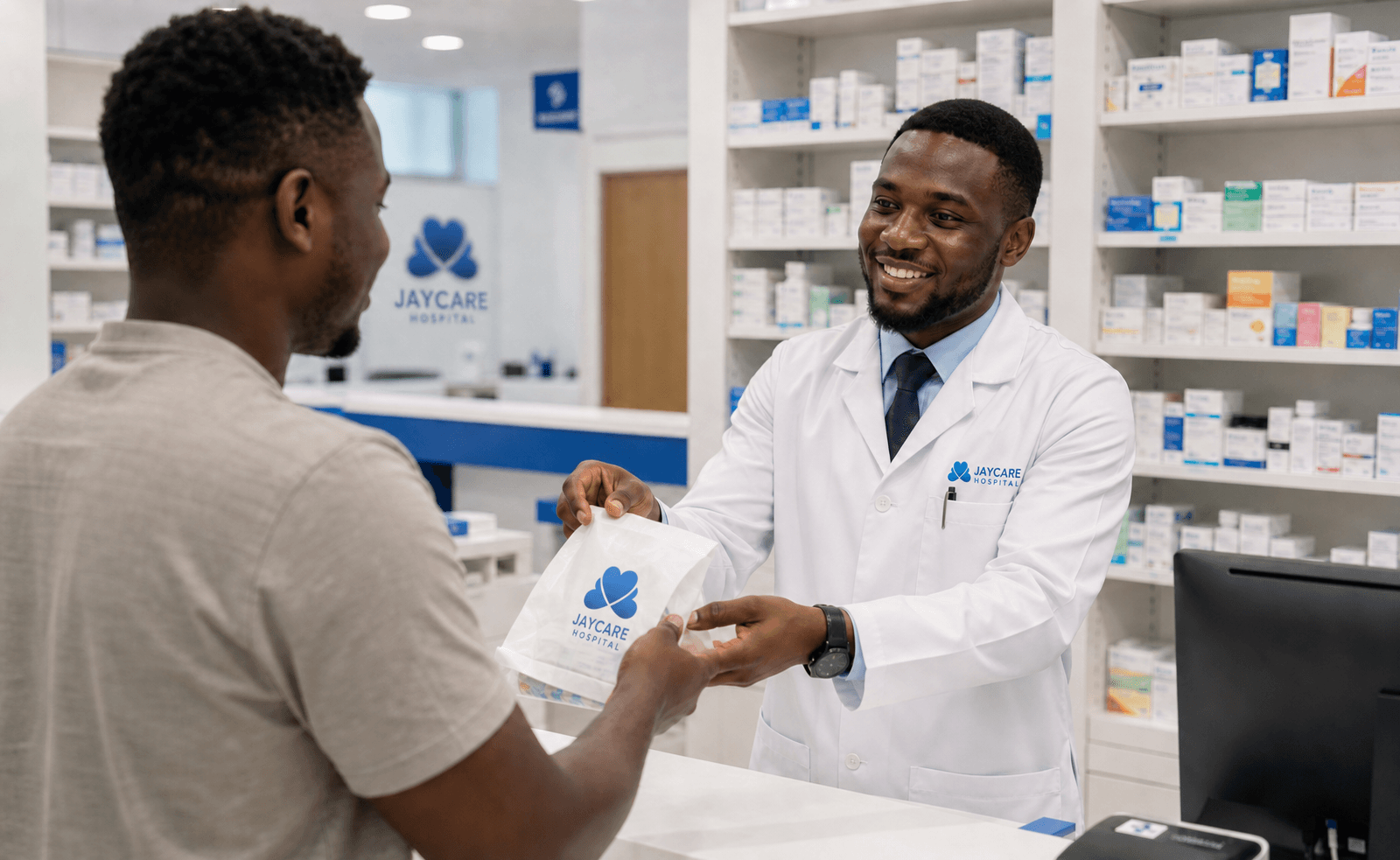A Jaycare pharmacist assisting a visitor at the hospital pharmacy